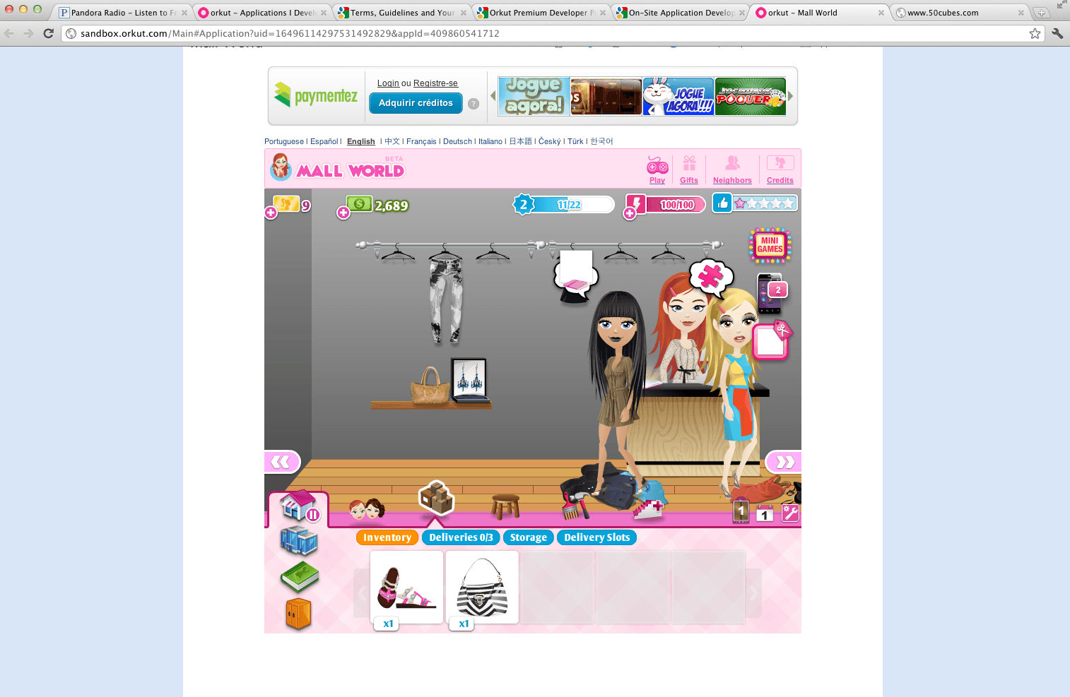 Mall World running inside Orkut's developer sandbox in 2011, with the Orkut application-developer documentation open in adjacent tabs, a Paymentez credits bar above the game, and a switcher offering eleven locales